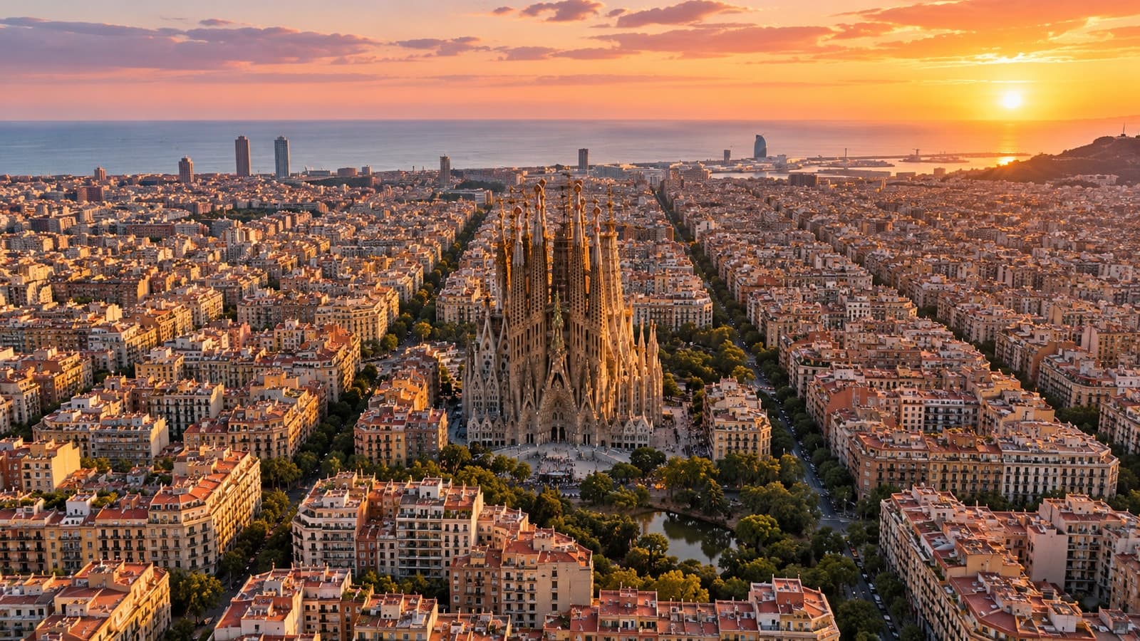 Barcelona Sagrada Família aerial overlooking Eixample and Mediterranean coast